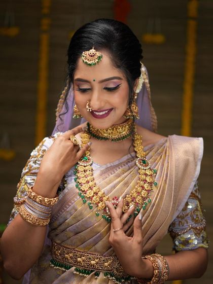 A gorgeous series of a model in a light purple saree, wearing our kemp stone bridal set. These photos show the jewellery from various angles, highlighting its beauty.