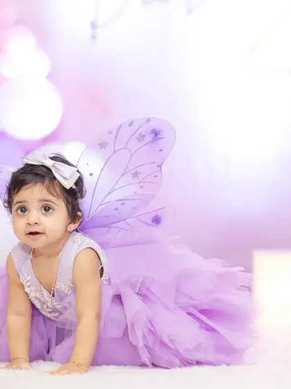 Capturing a real-life angel at her first birthday party. Milestone shoots for kids are all about capturing their curious and adorable expressions in a fun, relaxed setting.