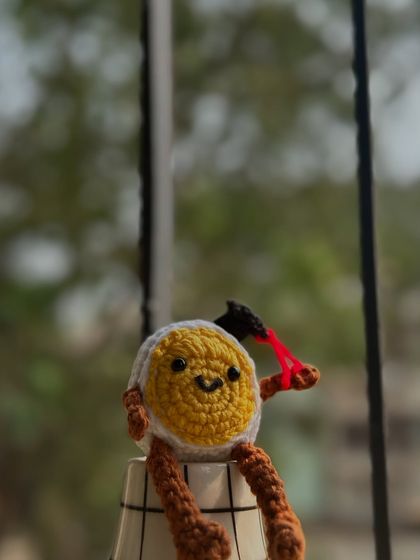 This graduated egg with a slingshot is one of my cheekiest creations. He's sitting proudly, ready to cause a little bit of fun chaos on your desk.