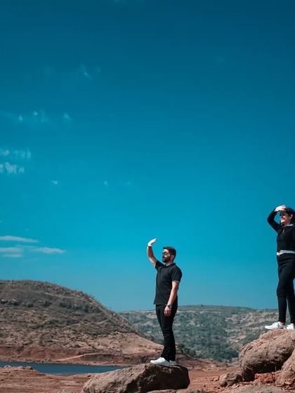 Another perspective of the couple looking out over the landscape. This shot captures a sense of shared adventure and looking towards the future together.