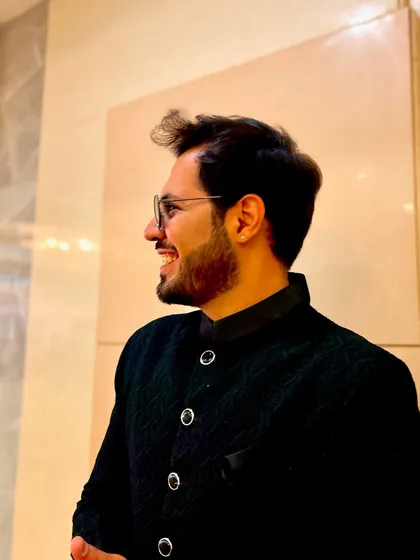 A side profile, smiling. This shows a softer, more approachable side of my personality.