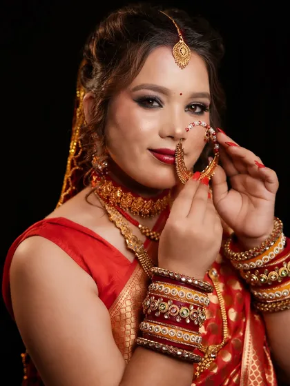 A beautiful Pahadi bridal look, complete with the traditional large nose ring (nath). Our courses celebrate and teach regional bridal traditions.