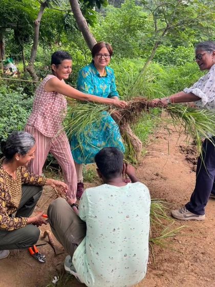 Workshop participants have fun while learning to make grass slips, a messy but effective technique for propagating native grasses.