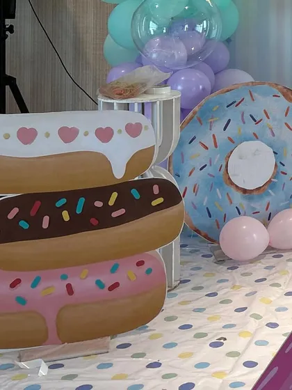 More custom props for our candy land party, featuring a stack of donuts and a large sprinkled donut cutout.