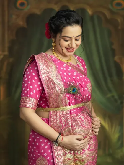 A close-up portrait capturing your gentle smile and the love you hold for your baby. The peacock feather adds a touch of traditional grace to this beautiful maternity photo.