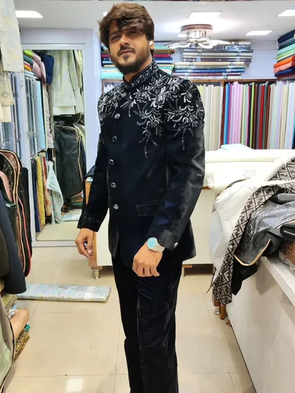 A client looking wonderful in a navy blue velvet Jodhpuri jacket with silver embroidery on the shoulders. This is a perfect outfit for a winter wedding or an evening reception.