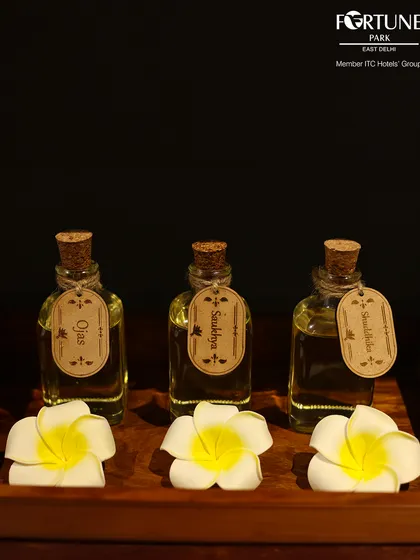 I use my own custom blends of therapeutic massage oils. This includes Ojas for energy and Saukhya for wellness, each carefully prepared to enhance your spa treatment and promote holistic well-being.