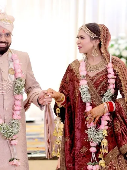 A classic shot of the bride and groom walking hand-in-hand after their ceremony.