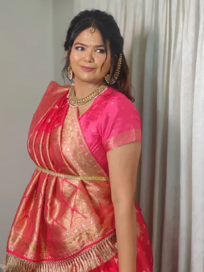 The full view of the Gujarati "sidha palla" saree drape, which I styled for her. Getting the drape right is just as important as the makeup.