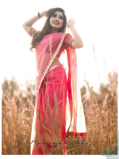 The lightweight and flowing nature of the organza saree makes it a perfect choice for any elegant occasion.