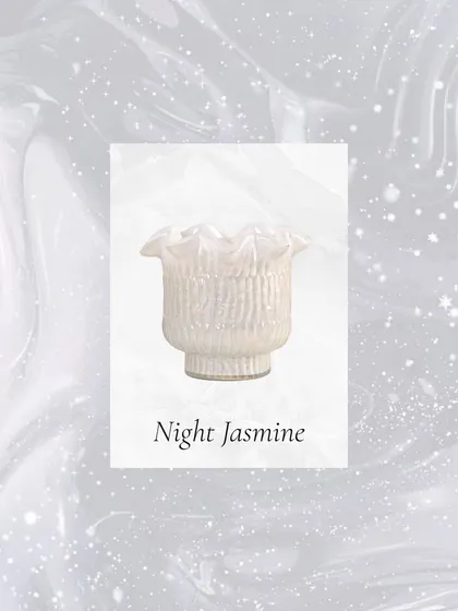 The delicate scent of Night Jasmine, housed in a pearly white Zen Lotus votive, is perfect for quiet summer evenings and moments of peaceful reflection.