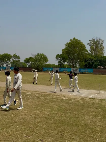 The team celebrating a wicket during their 8-wicket win.