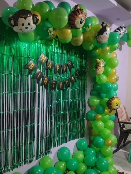 Another angle of the home-based jungle theme birthday setup, showing the arrangement of animal-shaped balloons.