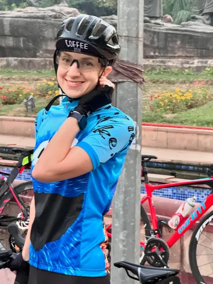 A member in a fun "Coffee Ride" jersey, smiling for the camera.
