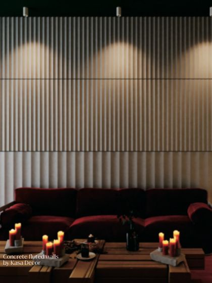 This living space features our concrete fluted walls. The vertical lines create an illusion of height and rhythm, while the spotlights highlight the texture, turning a simple wall into a sophisticated architectural feature.