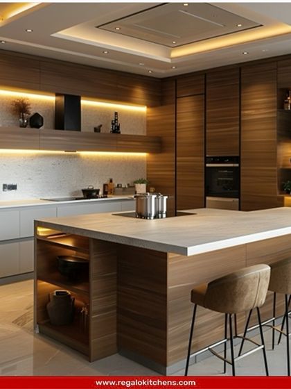 We designed this kitchen with warm wood finishes and a solid white island countertop to create a cozy yet modern feel. The integrated hob on the island and ample seating make it an ideal space for interactive cooking and entertaining.