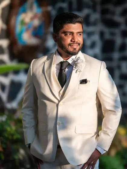 A sharp and dapper groom portrait. The warm, golden hour light gives this outdoor shot a beautiful glow.