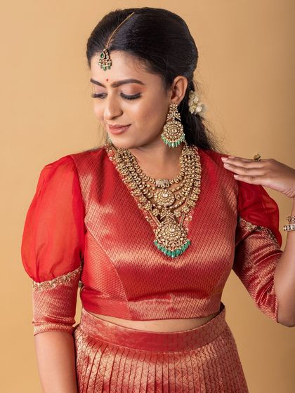 A makeup look created for a professional shoot, featuring a soft smokey eye and a neutral lip to balance the bold, layered antique necklaces.