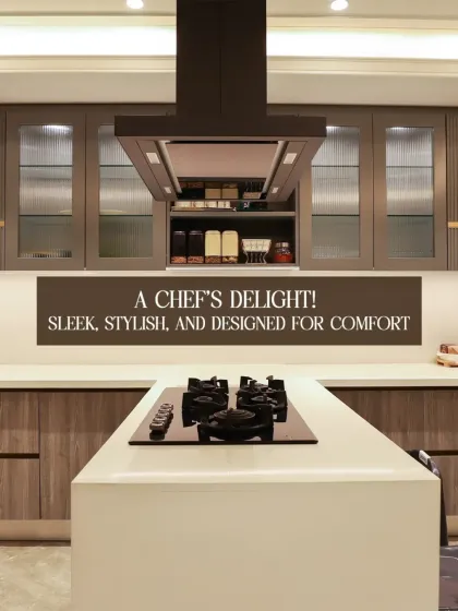 A chef's delight. This kitchen is sleek, stylish, and designed for comfort, featuring a large island cooktop, modern chimney, and ample storage with fluted glass cabinets.