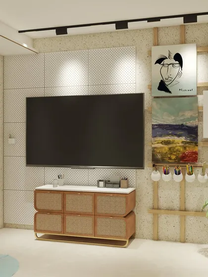 This custom media wall combines a TV unit with a creative gallery display. The cane-fronted console adds a touch of texture, while the wooden ladder structure provides a unique way to showcase art.