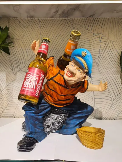 This happy fellow can carry two bottles on his shoulders, making for a very amusing display.