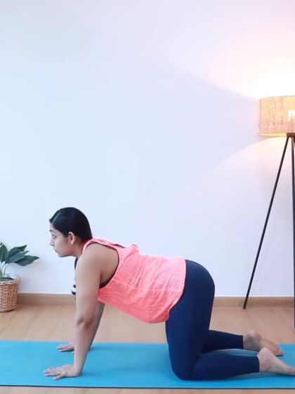The cat-cow stretch is a fundamental movement in prenatal yoga. It gently mobilizes the spine and can help position the baby for birth.