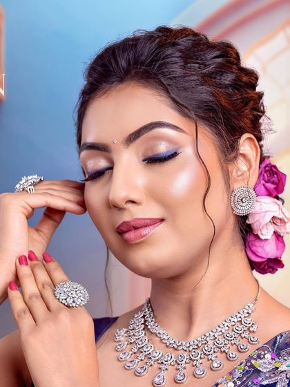 The closed-eye shot highlights the seamless blending and the dewy finish of the skin.