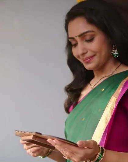 A still from a recent SBI TV commercial. This look required natural, relatable makeup that feels warm and authentic for a family setting.