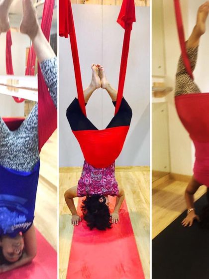 A trio of students enjoying the benefits of supported headstands. It's amazing how much better the world can look when you're upside down.