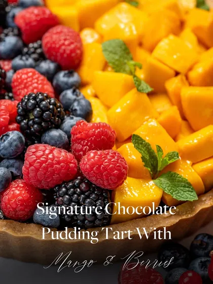 A close-up of my Signature Chocolate Pudding Tart with Mango & Berries. This dessert is fruity, fabulous, and bursting with the best of both worlds.