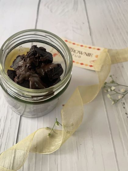 A jar of our decadent mini chocolate brownies, another delightful treat featured in our popular Rakhi indulgence hamper.