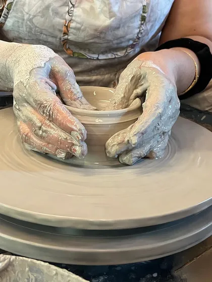 There's nothing quite like the feeling of wet clay spinning through your fingers. This is where the magic begins in our wheel throwing taster session.