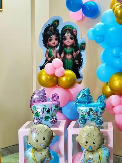 A close-up of the details in the Kanha ji baby shower. This shot highlights the "Baby Boy" and "Baby Girl" foil balloons, adding to the suspense and theme of the celebration.