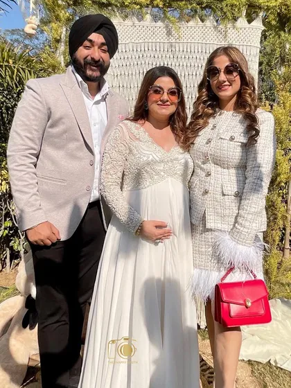 The happy couple with a friend at their baby shower. Our booth is there to capture all the key relationships and moments.