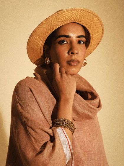 A beautifully styled portrait for House of Wandering Silk. The hat and the soft drape of the scarf create a timeless and elegant look.