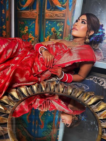 Another shot of the Bengali bride, showing the art of saree draping and how it creates a regal silhouette.