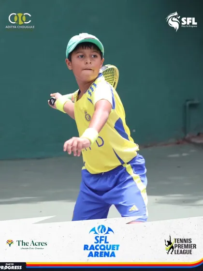 A young player in a bright yellow shirt moves into position for a backhand. Our coaching focuses on footwork and positioning to ensure players are always ready for the next shot.