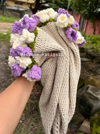 Holding the crochet blanket bouquet. It's a gift that is both beautiful on arrival and practical for years to come.