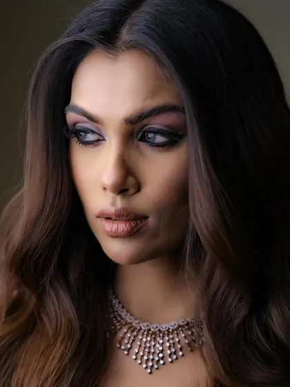 A dramatic and intense smokey eye look, perfect for a high-fashion or editorial-style shoot, or a bold reception look.