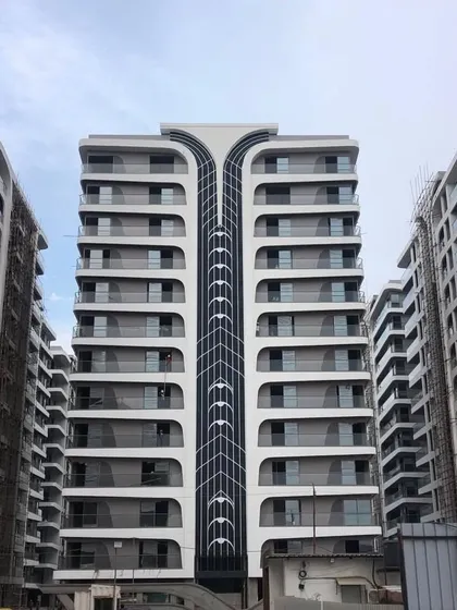 The facade of Rajhans Cremona in Surat showcases our passion for creating unique architectural forms. The flowing, organic lines are inspired by the shape of a violin, creating a visually dynamic structure that stands out in the urban landscape.