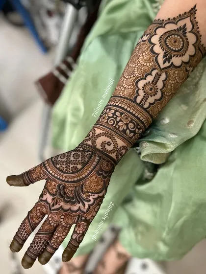 A single arm view, showing the intricate palm work.