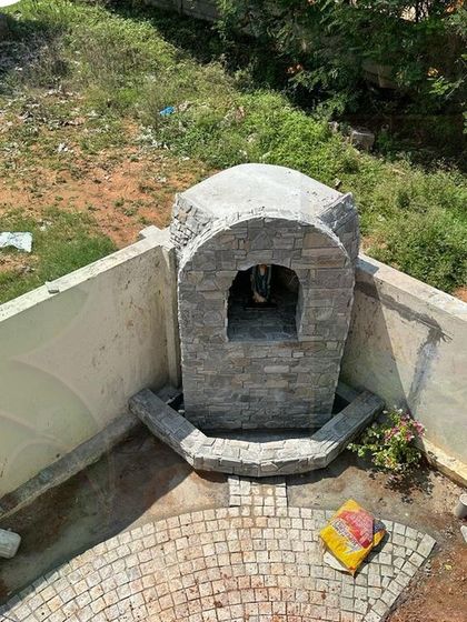 A close up of the stonework during the construction of a custom water feature. This image shows the detailed craftsmanship involved in creating durable and beautiful hardscape elements that form the backbone of our garden designs.