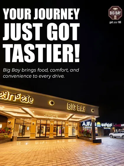 Your journey just got tastier. A welcoming night view of our main entrance, promising to bring food, comfort, and convenience to every drive.