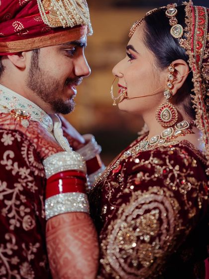A romantic close-up. You can see the detail of her eye makeup and the soft lip color that completes her classic bridal look.