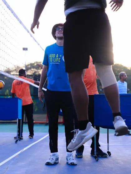 Watching a player's jump during a spike drill, I assess their form to provide immediate feedback.