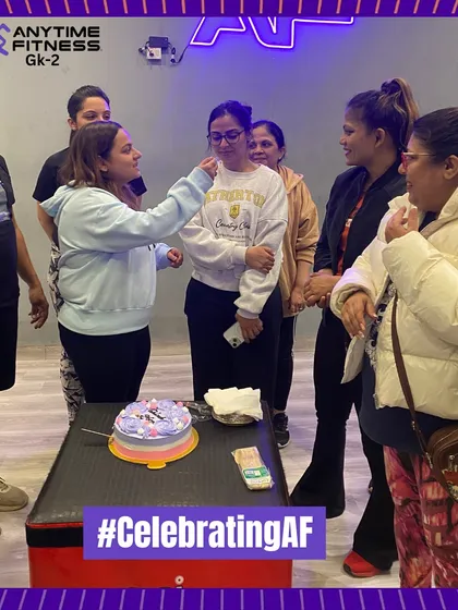 Sharing cake and smiles with our members to celebrate our collective success.