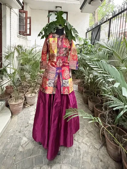 This version of the outfit features a short kurta with a skirt, customized to our client's preference.