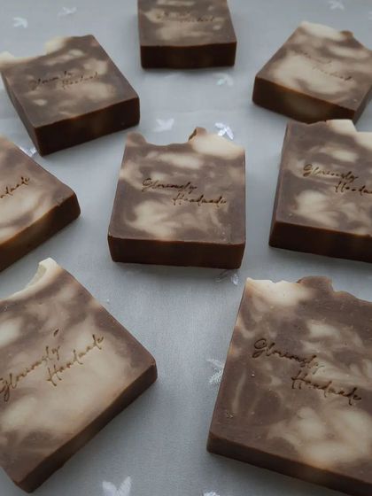 These are my Neem Cucumber soap bars, featuring a beautiful brown and white swirl. I use real neem and cucumber purees for their clarifying and cooling properties, making this a great soap for troubled skin.