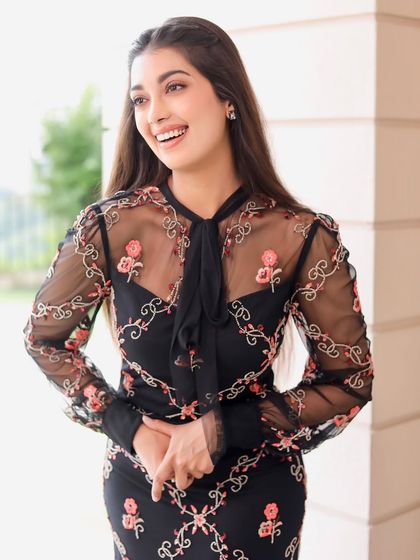 A candid, happy shot of Digangana. The natural makeup look enhances her features without looking heavy, making it perfect for this light and airy photoshoot.