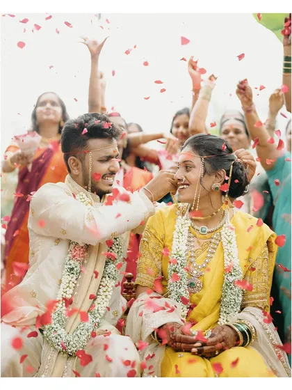 The air filled with laughter and a shower of petals during Pratik and Yamini's Maharashtrian wedding. This is the kind of uninhibited joy I live to capture, a candid moment of pure celebration.